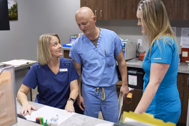 Ophthalmology Associates, S.C. eye care team with patient