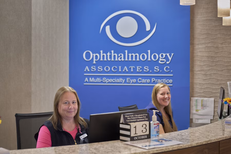 Ophthalmology Associates Milwaukee eye clinic reception staff assisting patients at trusted ophthalmology