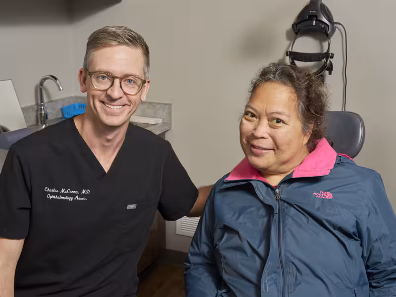 Ophthalmology Associates referring providers partnership featuring ophthalmologist with patient during trusted eye care consultation and referral support
